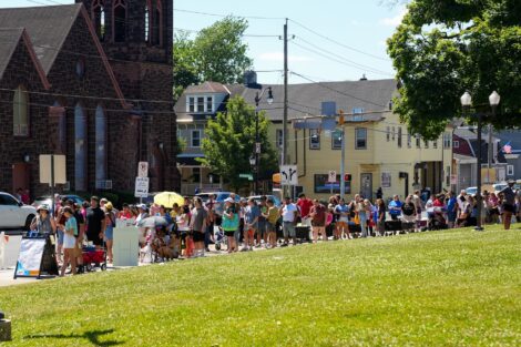 A line of people wraps around Paxinosa Elementary School.