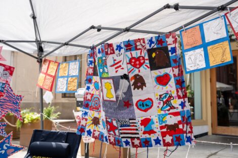 A multicolor banner waves in the breeze, with each piece designed by Easton's fourth graders.