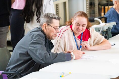 A Lafayette student chats with a Gracedale resident during the Pre-Orientation Service Program.