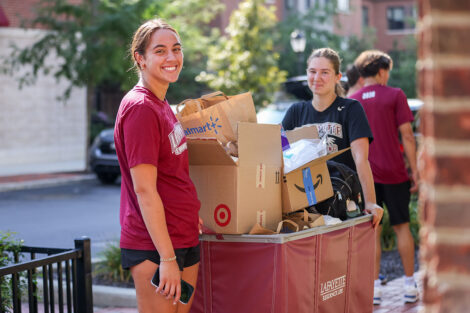 Students use one of the many carts available on campus to lighten the unpacking load.