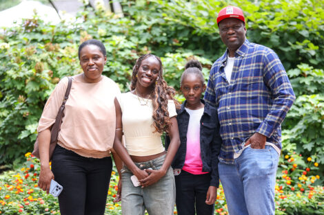 A family stops for a quick family photo during Move-in weekend.