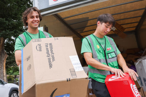 Students break down cardboard boxes during the Green Move-in.