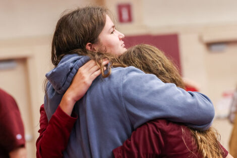 Families embrace at the reception following Convocation.