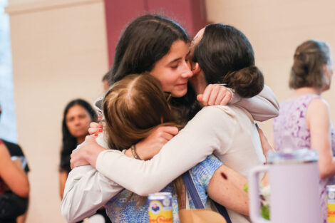 A family shares an embrace following Convocation.