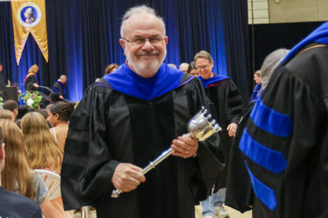 Members of the faculty and College Administration proces into Kirby Sports Center for Convocation.