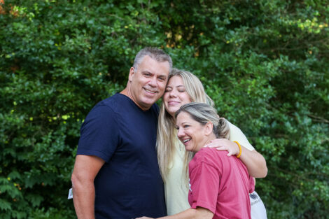 A families poses for a quick picture on Move-in weekend.