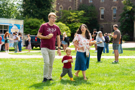 A family walks across the quad during the Marquis de Lafayette's birthday celebrtion.