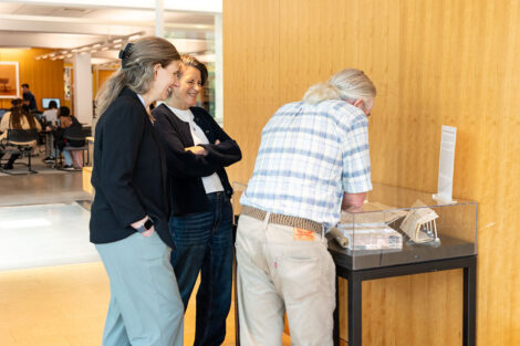 Faculty members take a look at the time capsule on display in Skillman Library.