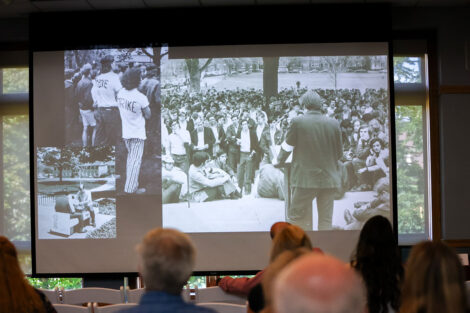 The symposium featured six panels with 20 faculty and academic staff representing more than 10 departments and programs, reflecting Lafayette’s liberal arts strengths. Participants look at historical photos shared during one of the presentations. Photos by JaQuan Alston and Ashli Truchon Novak
