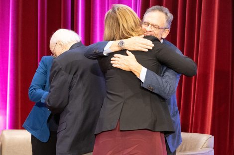 Lafayette College President Nicole Hurd embraces forer president Daniel Weiss